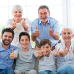 Family showing thumbs up